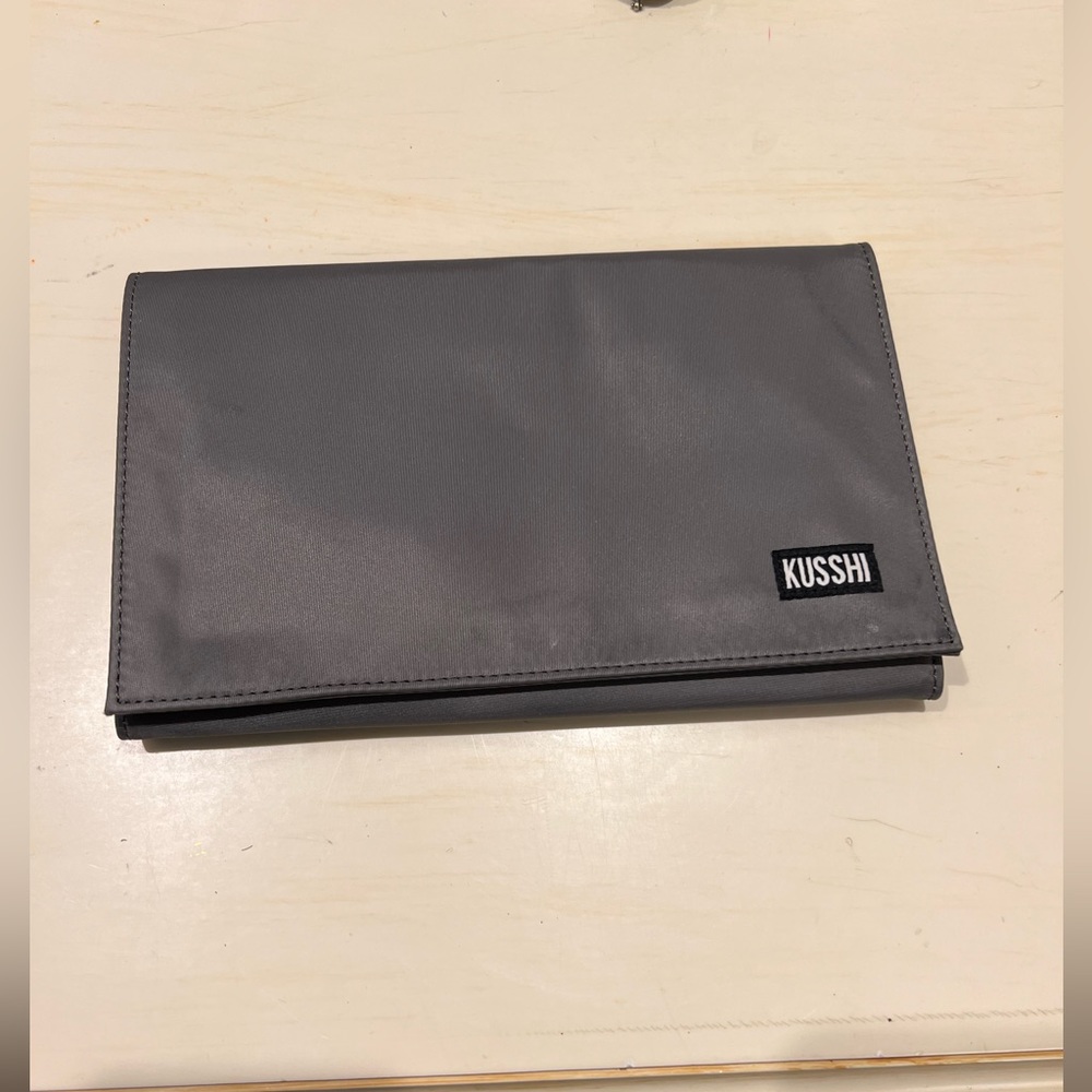 A KUSSHI brush holder - slightly used, but has a couple of light make up stains.